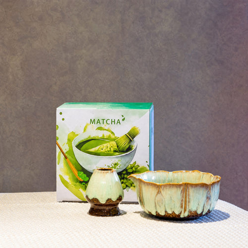 Green kiln-glaze two-piece matcha set with its ceramic bowl and gift box printed with the word Matcha