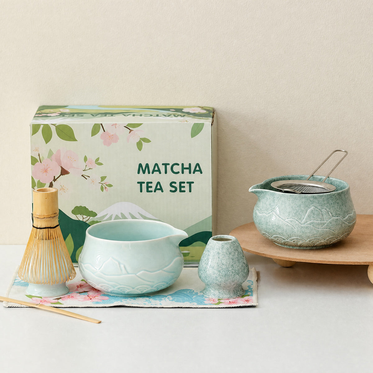 Two glazed matcha bowls with mountain relief, side by side